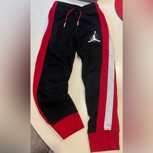 Nike boys Air Jordan sweatpants size small 8-10 years. Black and red.